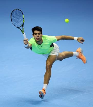 (231119) -- TURIN, Nov. 19, 2023 -- Carlos Alcaraz of Spain hits a return during the semifinal match between Carlos Alcaraz of Spain and Novak Djokovic of Serbia at ATP, Tennis Herren Finals tennis tournament in Turin, Italy, Nov. 18, 2023. (Photo by Xinhua) (SP)ITALY-TURIN-TENNIS-ATP FINALS AlbertoxLingria 