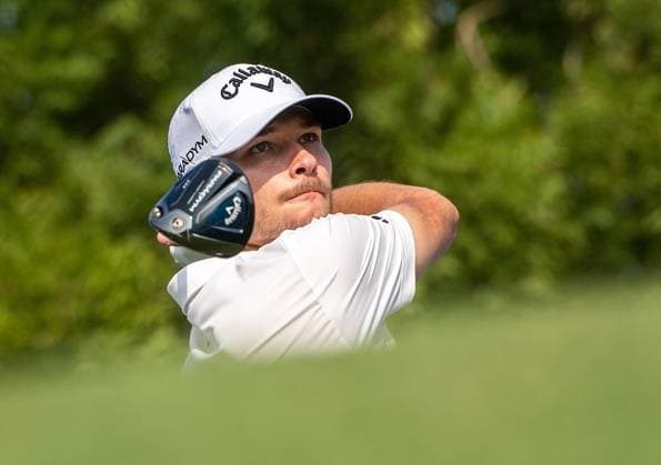 NICOLAI HoJGAARD of Denmark tees off at the 14th hole during DP World Tour Championship in Dubai, United Arab Emirates, Nov 19, 2023. Dubai United Arab Emirates  Copyright: xMARTINxDOKOUPILx 441_4110