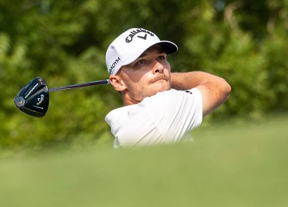 NICOLAI HoJGAARD of Denmark tees off at the 14th hole during DP World Tour Championship in Dubai, United Arab Emirates, Nov 19, 2023. Dubai United Arab Emirates  Copyright: xMARTINxDOKOUPILx 441_4111
