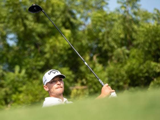 NICOLAI HoJGAARD of Denmark watches the ball after a tee-off at the 14th hole during DP World Tour Championship in Dubai, United Arab Emirates, Nov 19, 2023. Dubai United Arab Emirates  Copyright: xMARTINxDOKOUPILx 441_4113