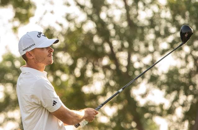 NICOLAI HoJGAARD of Denmark watches the ball after a tee-off at the 18th hole during DP World Tour Championship in Dubai, United Arab Emirates, Nov 19, 2023. Dubai United Arab Emirates  Copyright: xMARTINxDOKOUPILx 441_4251