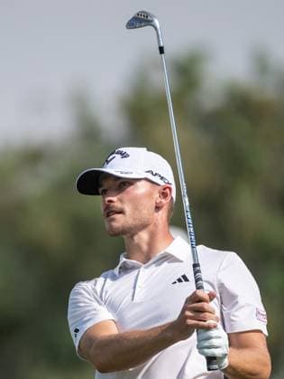 NICOLAI HoJGAARD of Denmark strikes the ball on the first fairway during DP World Tour Championship in Dubai, United Arab Emirates, Nov 19, 2023. Dubai United Arab Emirates  Copyright: xMARTINxDOKOUPILx 443_1481