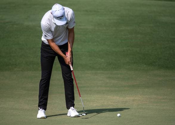 NICOLAI HoJGAARD of Denmark putts on the first green during DP World Tour Championship in Dubai, United Arab Emirates, Nov 19, 2023. Dubai United Arab Emirates  Copyright: xMARTINxDOKOUPILx 443_1496