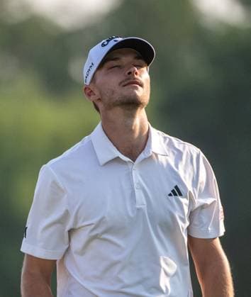 NICOLAI HoJGAARD of Denmark reacts after missing a putt on the 18th green during DP World Tour Championship in Dubai, United Arab Emirates, Nov 19, 2023. Dubai United Arab Emirates  Copyright: xMARTINxDOKOUPILx 443_2108