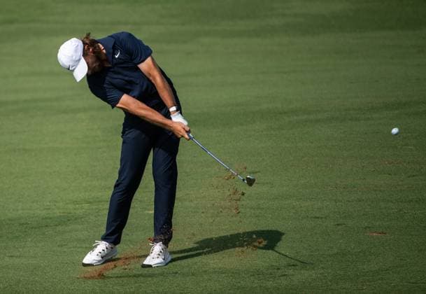 TOMMY FLEETWOOD of England strikes the ball on the fifth fairway during DP World Tour Championship in Dubai, United Arab Emirates, Nov 19, 2023. Dubai United Arab Emirates  Copyright: xMARTINxDOKOUPILx 443_1705