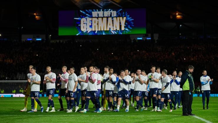 19th November 2023; Hampden Park, Glasgow, Scotland: Euro 2024 Qualifier Football, Scotland versus Norway; Scotland players celebrate as the scoreboard behind displays we& x2019;re off to Germany  ActionPlus12577827 VagelisxGeorgariou
