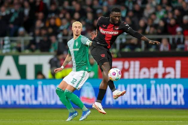 Germany, Bremen, 25 11 2023, WOHNINVEST Weserstadion, Werder Bremen vs Bayer 04 Leverkusen 1 Bundesliga, Marco Friedl Werder Bremen and Victor Boniface Bayer 04 Leverkusen battle for the ball Bremen WOHNINVEST Weserstadion Germany  eu-images-108
