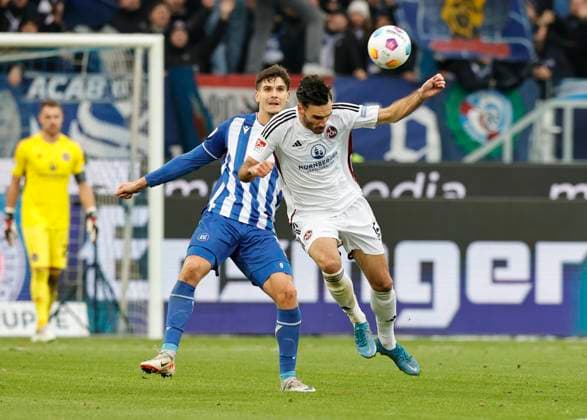 26 11 2023 Soccer Season 2023 2024 2 Soccer Bundesliga 14 Matchday Karlsruher SC KSC 1 FC Nuremberg FCN Club Sportfoto Zink DaMa xdaxmax DFL regulations prohibit any use of photographs as image sequences and or quasi video only for editorial use Igor Matanovic 9, Karlsruher SC KSC in header duel with Ivan Marquez 15, 1 FC Nuremberg FCN