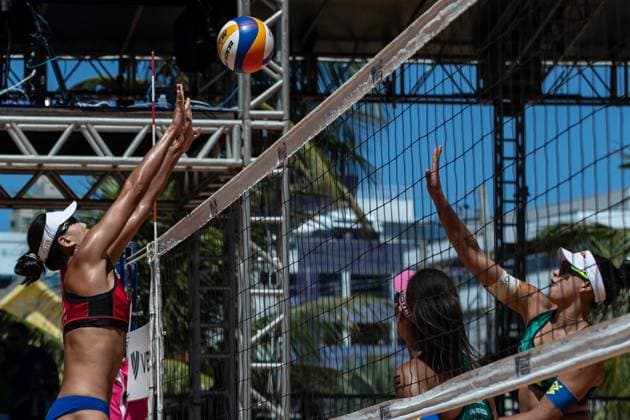 (231126) -- JOAO PESSOA, Nov. 26, 2023 -- Xue Chen (L) of China blocks during the women s semifinal match between Xue Chen Xia Xinyi of China and Ana Patricia Duda of Brazil at the World Beach volleyball, Beachvolleyball Pro Tour 2023 in Joao Pessoa, Brazil, Nov. 26, 2023. ) (SP)BRAZIL-JOAO PESSOA-BEACH VOLLEYBALL-WORLD PRO TOUR WangxTiancong 