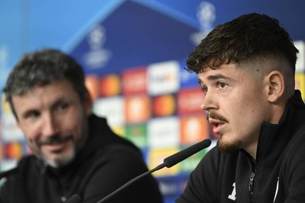 Antwerp s head coach Mark van Bommel and Antwerp s Arbnor Muja pictured during a press conference, PK, Pressekonferenz of Belgian soccer team Royal Antwerp FC, on Monday 27 November 2023 in Hamburg, Germany. The team is preparing for tomorrow s game against Ukrainian club Shakhtar Donetsk, on day five of the Champions League group stage, in group H. TOM GOYVAERTS TomxGoyvaerts  x80933722x