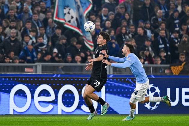 Matt O Riley of Celtic FC and Mario Gila of SS Lazio compete for the ball during the Uefa Champions League match between SS Lazio and Celtic FC at Stadio Olimpico Rome Italy on 28 November 2023. Photo Nicola Ianuale Rome Stadio Olimpico Rome Italy Copyright: xNicolaxIanualex SP24-763-004