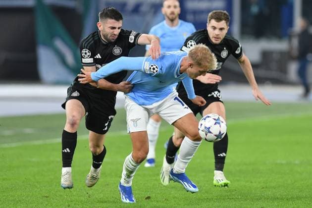 28th November 2023, Stadio Olimpico, Rome, Italy; Champions League, Group Stage Football; Lazio versus Celtic; Greg Taylor of Celtic pressures Gustv Isaksen of SS Lazio  ActionPlus12580777 AllShotLive