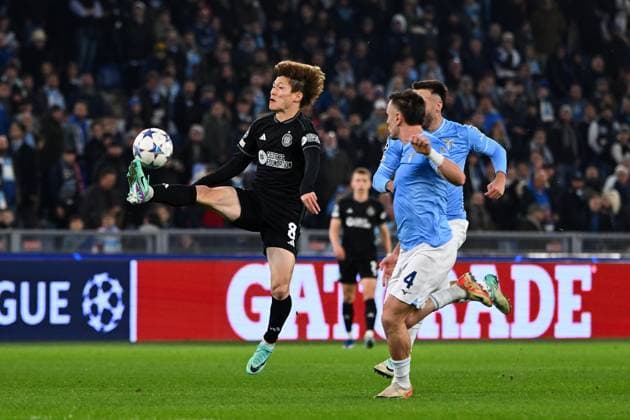 Kyogo Furuhashi of Celtic FC and Patric of SS Lazio compete for the ball during the Uefa Champions League match between SS Lazio and Celtic FC at Stadio Olimpico Rome Italy on 28 November 2023. Photo Nicola Ianuale Rome Stadio Olimpico Rome Italy Copyright: xNicolaxIanualex SP24-763-007