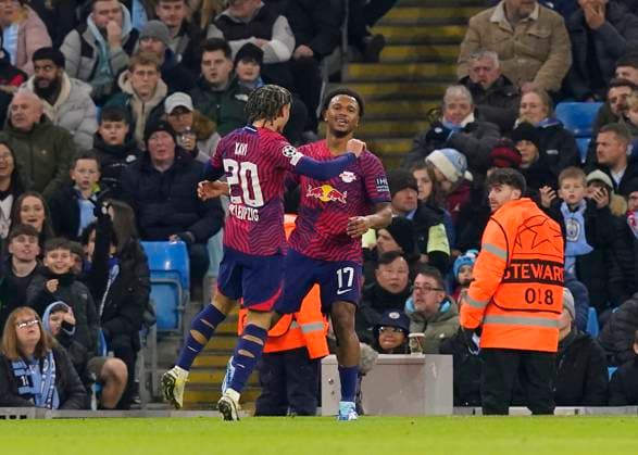 Manchester, England, 28th November 2023. LoÃ¯s Openda of RB Leipzig (r) celebrates scoring their first goal during the UEFA Champions League match at the Etihad Stadium, Manchester. Picture credit should read: Andrew Yates Sportimage EDITORIAL USE ONLY. No use with unauthorised audio, video, data, fixture lists, club league logos or live services. Online in-match use limited to 120 images, no video emulation. No use in betting, games or single club league player publications. SPI-2749-0022
