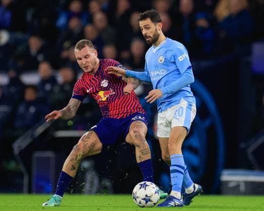 UEFA Champions League Group G Manchester City v RB Leipzig David Raum 22 of RB Leipzig and Bernardo Silva 20 of Manchester City battle for the ball during the UEFA Champions League Group G match Manchester City vs RB Leipzig at Etihad Stadium, Manchester, United Kingdom, 28th November 2023 (Photo by Conor Molloy News Images) Manchester Etihad Stadium Manchester United, ManU Kingdom Copyright: xConorxMolloy NewsxImagesx