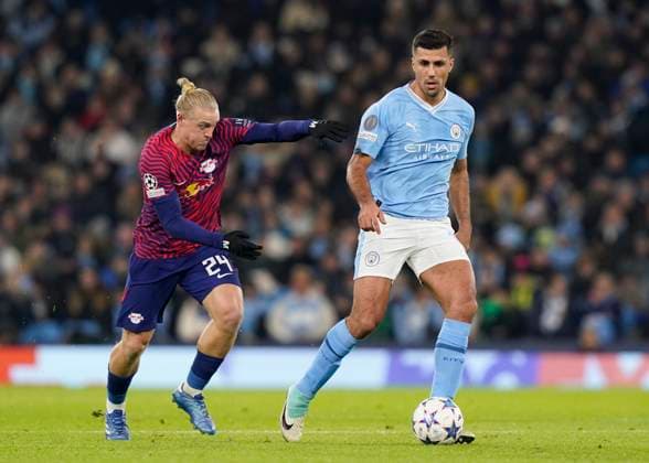 Manchester, England, 28th November 2023. Xaver Schlager of RB Leipzig and Rodri of Manchester City during the UEFA Champions League match at the Etihad Stadium, Manchester. Picture credit should read: Andrew Yates Sportimage EDITORIAL USE ONLY. No use with unauthorised audio, video, data, fixture lists, club league logos or live services. Online in-match use limited to 120 images, no video emulation. No use in betting, games or single club league player publications. SPI-2749-0029