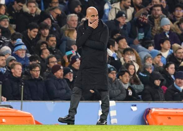 Manchester, England, 28th November 2023. A worried looking Josep Guardiola coach of Manchester City during the UEFA Champions League match at the Etihad Stadium, Manchester. Picture credit should read: Andrew Yates Sportimage EDITORIAL USE ONLY. No use with unauthorised audio, video, data, fixture lists, club league logos or live services. Online in-match use limited to 120 images, no video emulation. No use in betting, games or single club league player publications. SPI-2749-0034