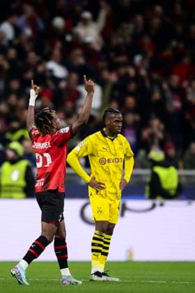 AC Milan v Borussia Dortmund - UEFA Champions League Samuel Chukwueze of AC Milan celebrates after scoring a goal as Jamie Bynoe-Gittens of Borussia Dortmund looks dejected during the Serie A football match between AC Milan and Borussia Dortmund. Milan Italy Copyright: xNicolòxCampox