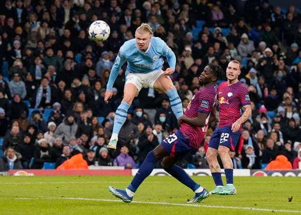 Manchester, England, 28th November 2023. Erling Haaland of Manchester City directs a weak.header towards goal during the UEFA Champions League match at the Etihad Stadium, Manchester. Picture credit should read: Andrew Yates Sportimage EDITORIAL USE ONLY. No use with unauthorised audio, video, data, fixture lists, club league logos or live services. Online in-match use limited to 120 images, no video emulation. No use in betting, games or single club league player publications. SPI-2749-0036