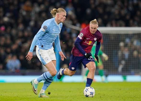 Manchester, England, 28th November 2023. Erling Haaland of Manchester City tracked by Xaver Schlager of RB Leipzig during the UEFA Champions League match at the Etihad Stadium, Manchester. Picture credit should read: Andrew Yates Sportimage EDITORIAL USE ONLY. No use with unauthorised audio, video, data, fixture lists, club league logos or live services. Online in-match use limited to 120 images, no video emulation. No use in betting, games or single club league player publications. SPI-2749-0042