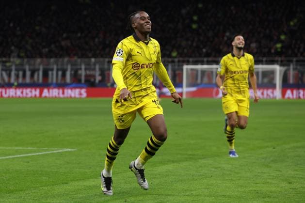 Milan, Italy, 28th November 2023. Jamie Bynoe-Gittens of Borussia Dortmund celebrates with team mates after scoring to give the side a 2-1 lead during the UEFA Champions League match at Giuseppe Meazza, Milan. Picture credit should read: Jonathan Moscrop Sportimage EDITORIAL USE ONLY. No use with unauthorised audio, video, data, fixture lists, club league logos or live services. Online in-match use limited to 120 images, no video emulation. No use in betting, games or single club league player publications. SPI-2754-0030