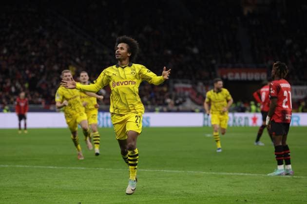 Milan, Italy, 28th November 2023. Karim Adeyemi of Borussia Dortmund celebrates after scoring to give the side a 3-1 lead during the UEFA Champions League match at Giuseppe Meazza, Milan. Picture credit should read: Jonathan Moscrop Sportimage EDITORIAL USE ONLY. No use with unauthorised audio, video, data, fixture lists, club league logos or live services. Online in-match use limited to 120 images, no video emulation. No use in betting, games or single club league player publications. SPI-2754-0035