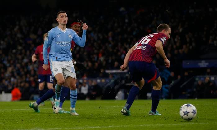 MANCHESTER, ENGLAND - NOVEMBER 28: Phil Foden of Manchester City scores their second goal during the UEFA Champions League match between Manchester City and Rb Leipzig at Etihad Stadium on November 28, 2023 in Manchester, England SPO 