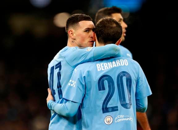 Football - 2023 2024 UEFA Champions League - Group G - Matchday Five of Six - Manchester City vs RB Leipzig - Etihad Stadium - Tuesday 28th November 2023 Phil Foden of Manchester City celebrates with Bernardo Silva after he scores in the second half to bring City back into the game at 2-2, at the Etihad. 