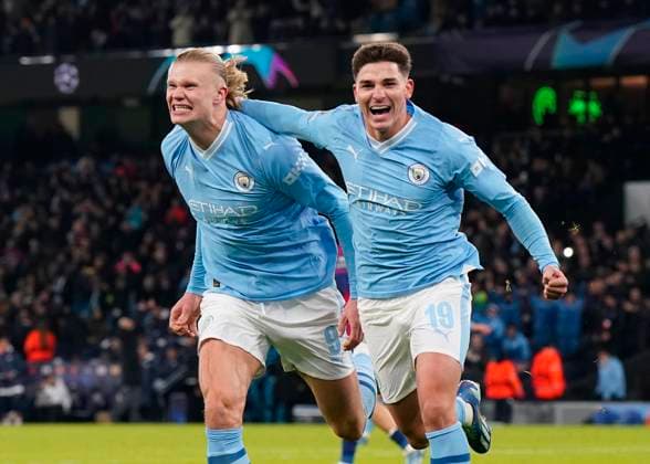 Manchester, England, 28th November 2023. Julian Alvarez of Manchester City (r) celebrates scoring their third goal during the UEFA Champions League match at the Etihad Stadium, Manchester. Picture credit should read: Andrew Yates Sportimage EDITORIAL USE ONLY. No use with unauthorised audio, video, data, fixture lists, club league logos or live services. Online in-match use limited to 120 images, no video emulation. No use in betting, games or single club league player publications. SPI-2749-0048