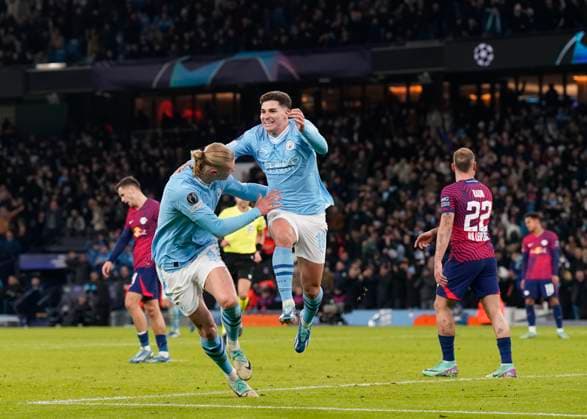 Manchester, England, 28th November 2023. Julian Alvarez of Manchester City (r) celebrates scoring their third goal during the UEFA Champions League match at the Etihad Stadium, Manchester. Picture credit should read: Andrew Yates Sportimage EDITORIAL USE ONLY. No use with unauthorised audio, video, data, fixture lists, club league logos or live services. Online in-match use limited to 120 images, no video emulation. No use in betting, games or single club league player publications. SPI-2749-0056