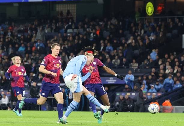 28th November 2023; Etihad Stadium, Manchester, England; Champions League Football, Group Stage, Manchester City versus RB Leipzig; Erling Haaland of Manchester City beats Janis Blaswich of RB Leipzig after 54 minutes to make the score 1-2  ActionPlus12580879 DavidxBlunsden