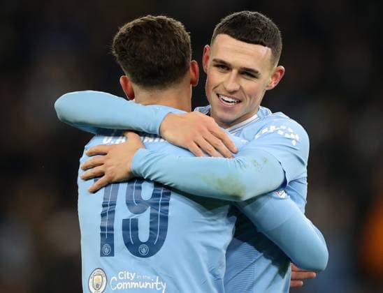 28th November 2023; Etihad Stadium, Manchester, England; Champions League Football, Group Stage, Manchester City versus RB Leipzig; Phil Foden of Manchester City team mate Julian Alvarez after his winning goal  ActionPlus12580952 DavidxBlunsden