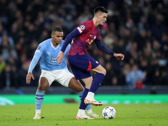 28th November 2023; Etihad Stadium, Manchester, England; Champions League Football, Group Stage, Manchester City versus RB Leipzig; Benjamin Sesko of RB Leipzig sheilds the ball from Manuel Akanji of Manchester City  ActionPlus12580980 DavidxBlunsden