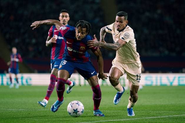 (231129) -- BARCELONA, Nov. 29, 2023 -- Jules Kounde (C) of Barcelona vies with Galeno of Porto during the UEFA Champions League Group H match between FC Barcelona, Barca and FC Porto in Barcelona, Spain, on Nov. 28, 2023. (Photo by Xinhua) (SP)SPAIN-BARCELONA-FOOTBALL-UEFA CHAMPIONS LEAGUE-BARCELONA VS FC PORTO JoanxGosa 