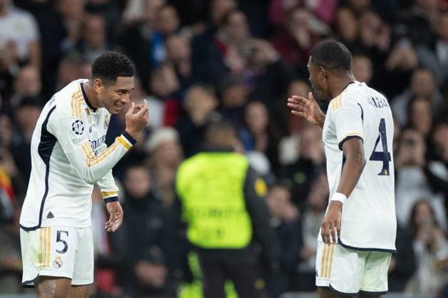(231130) -- MADRID, Nov. 30, 2023 -- Real Madrid s Jude Bellingham (L) celebrates a goal with David Alaba during the UEFA Champions League Group C match between Real Madrid and SSC Napoli at the Santiago Bernabeu Stadium in Madrid, Spain, on Nov. 29, 2023. ) (SP)SPAIN-MADRID-FOOTBALL-UEFA CHAMPIONS-REAL MADRID VS SSC NAPOLI MengxDingbo 