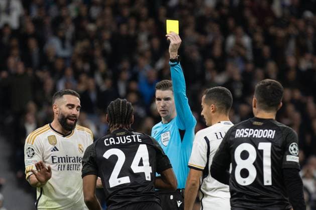 (231130) -- MADRID, Nov. 30, 2023 -- Napoli s Jens Cajuste (2nd L) receives a yellow card during the UEFA Champions League Group C match between Real Madrid and SSC Napoli at the Santiago Bernabeu Stadium in Madrid, Spain, on Nov. 29, 2023. ) (SP)SPAIN-MADRID-FOOTBALL-UEFA CHAMPIONS-REAL MADRID VS SSC NAPOLI MengxDingbo 