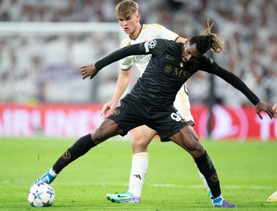 (231130) -- MADRID, Nov. 30, 2023 -- Real Madrid s Nicolas Paz (back) vies with Napoli s Andre-Frank Zambo Anguissa during the UEFA Champions League Group C match between Real Madrid and SSC Napoli at the Santiago Bernabeu Stadium in Madrid, Spain, on Nov. 29, 2023. ) (SP)SPAIN-MADRID-FOOTBALL-UEFA CHAMPIONS-REAL MADRID VS SSC NAPOLI MengxDingbo 