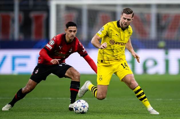 AC Milan v Borussia Dortmund - UEFA Champions League Niclas Fullkrug of Borussia Dortmund competes for the ball with Tijjani Reijnders of AC Milan during the Serie A football match between AC Milan and Borussia Dortmund. Milan Italy Copyright: xNicolòxCampox