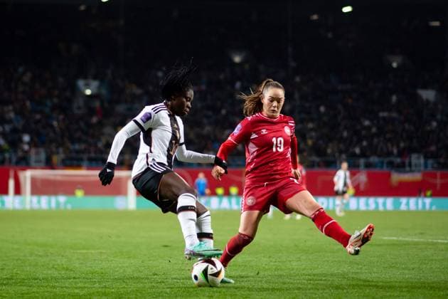 Nicole Anyomi Germany, 18 in duel with Janni Thomsen Denmark, 19 , GER, Germany GER vs Denmark DEN , UEFA Womens Football Nations League, Liga A, Matchday 5, 01 12 2023 DFB DFL regulations prohibit any use of photographs as image sequences and or quasi video GER, Germany GER vs Denmark DEN , UEFA Womens Football Nations League, Liga A, Matchday 5, 01 12 2023 Rostock Copyright: xEibner-Pressefoto Memmlerx EP_MMR
