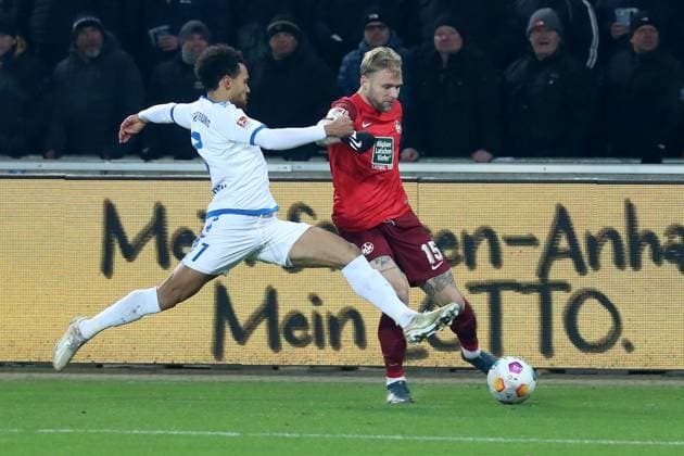 02 12 2023, xgox, Fussball 2 Bundesliga, 1 FC Magdeburg 1 FC Kaiserslautern emspor, v l Malcolm Cacutalua 1 FC Magdeburg Tymoteusz Puchacz 1 FC Kaiserslautern Zweikampf, Aktion, action, battle for the ball DFL DFB REGULATIONS PROHIBIT ANY USE OF PHOTOGRAPHS as IMAGE SEQUENCES and or QUASI VIDEO Magdeburg