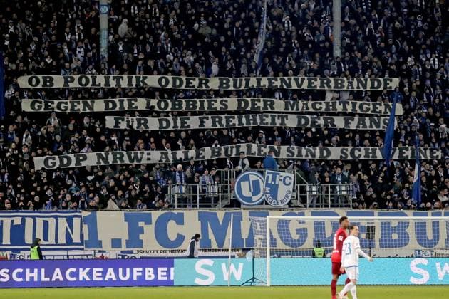 02 12 2023, xgox, Fussball 2 Bundesliga, 1 FC Magdeburg 1 FC Kaiserslautern emspor, v l Fans, atmosphere, scarves, flags, visitors, Ultras, jerseys banner poster against the police DFL DFB REGULATIONS PROHIBIT ANY USE OF PHOTOGRAPHS as IMAGE SEQUENCES and or QUASI VIDEO Magdeburg