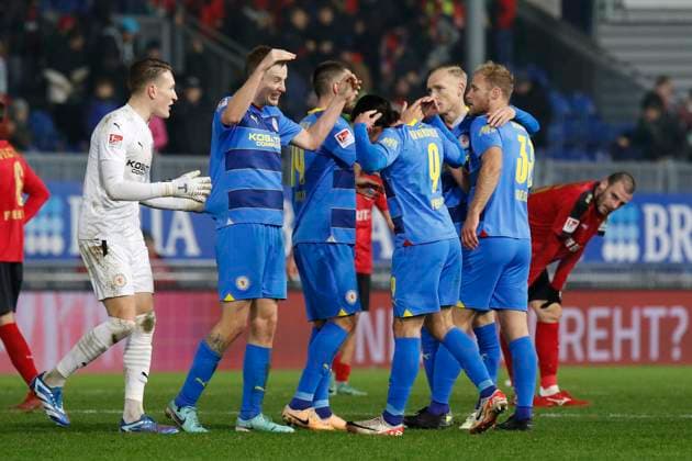 08 12 2023, xavx, Soccer 2 Bundesliga, SV Wehen Wiesbaden Eintracht Braunschweig emspor, f l Goalkeeper Ron Thorben Hoffmann Eintracht Braunschweig , Ermin Bicakcic Eintracht Braunschweig , Rayan Philippe Eintracht Braunschweig cheering after the end of the match DFL DFB REGULATIONS PROHIBIT ANY USE OF PHOTOGRAPHS as IMAGE SEQUENCES and or QUASI VIDEO Wiesbaden