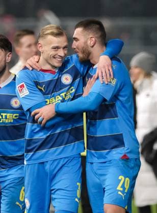 Saulo Decarli Eintracht Braunschweig, 03 and Hasan Kurucay Eintracht Braunschweig, 29 are happy about victory, GER, SV Wehen Wiesbaden vs Eintracht Braunschweig, Football, 2 Bundesliga, Matchday 16, Season 2023 2024, 08 12 2023 DFL REGULATES PROHIBIT ANY USE OF PHOTOGRAPHS AS IMAGE SEQUENCES AND OR QUASI VIDEO GER, SV Wehen Wiesbaden vs Eintracht Braunschweig, Football, 2 Bundesliga, Matchday 16, Season 2023 2024, 08 12 2023 Wiesbaden Copyright: xEibner-Pressefoto FlorianxWieganx EP_FWD