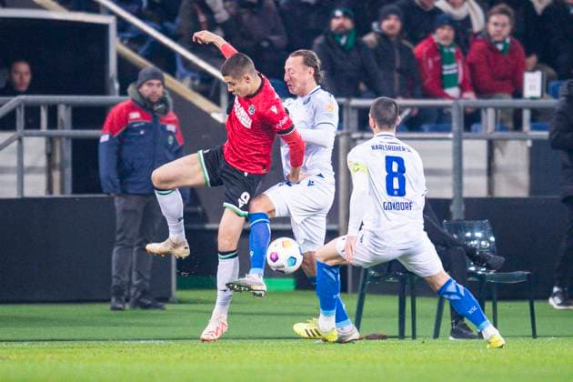 08 12 2023 Soccer, 2023 2024, 2 Bundesliga, Matchday 16, Hannover 96 Karlsruher SC L R Nicolo Tresoldi Hannover , Robin Bormuth Karlsruhe , Jerome Gondorf Karlsruhe DFL REGULATIONS PROHIBIT ANY USE OF PHOTOGRAPHS AS IMAGE SEQUENCES AND OR QUASI VIDEO Hannover Lower Saxony Germany Heinz von Heiden Arena