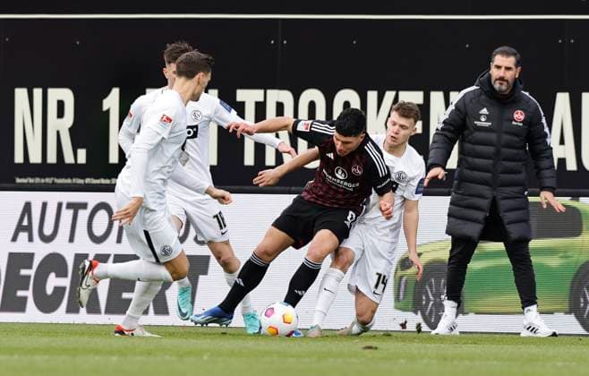 10 12 2023 Soccer Season 2023 2024 2 Soccer Bundesliga 16 Matchday SV Elversberg 1 FC Nürnberg FCN Club Sportfoto Zink DaMa xdaxmax DFL regulations prohibit any use of photographs as image sequences and or quasi video only for editorial use Paul Stock 21, SV Elversberg Taylan Duman 8, 1 FC Nürnberg FCN Robin Fellhauer 14, SV Elversberg watched by Cristian Fiel Coach 1 FC Nürnberg FCN