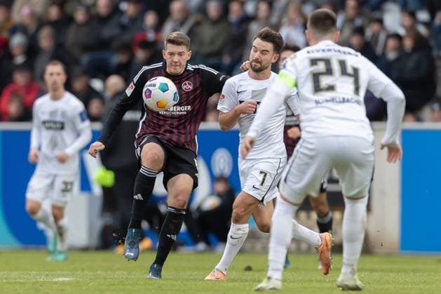 Germany, Spiesen Elversberg, 10 12 2023, Waldstadion Kaiserlinde, SV Elversberg vs FC Nürnberg 2 Bundesliga, Matchday 16, Taylan Duman 1 FC NUernberg and Manuel Feil SV 07 Elversberg battle for the ball Spiesen Elversberg URSAPHARM Arena an der Kaiserlinde Saarland Germany eu-images-542