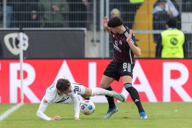Germany, Spiesen Elversberg, 10 12 2023, Waldstadion Kaiserlinde, SV Elversberg vs FC Nürnberg 2 Bundesliga, Matchday 16, Jannik Rochelt SV 07 Elversberg and Taylan Duman 1 FC NUernberg battle for the ball Spiesen Elversberg URSAPHARM Arena an der Kaiserlinde Saarland Germany eu-images-542