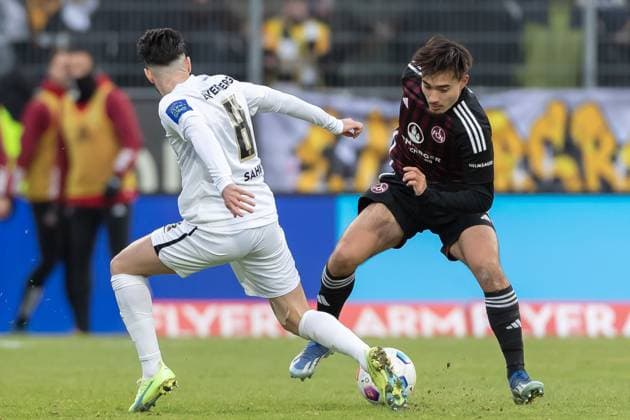 Germany, Spiesen Elversberg, 10 12 2023, Waldstadion Kaiserlinde, SV Elversberg vs FC Nürnberg 2 Bundesliga, 16 Matchday, Semih Sahin SV 07 Elversberg and Jens Castrop 1 FC Nuernberg battle for the ball Spiesen Elversberg URSAPHARM Arena an der Kaiserlinde Saarland Germany eu-images-542