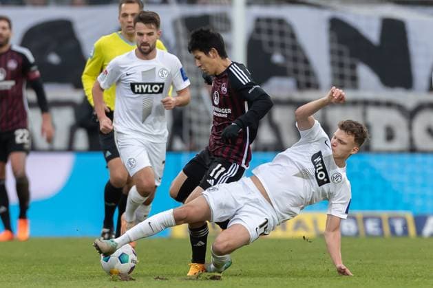 Germany, Spiesen Elversberg, 10 12 2023, Waldstadion Kaiserlinde, SV Elversberg vs FC Nürnberg 2 Bundesliga, Matchday 16, Kanji Okunuki 1 FC Nuernberg and Robin Fellhauer SV 07 Elversberg battle for the ball Spiesen Elversberg URSAPHARM Arena an der Kaiserlinde Saarland Germany eu-images-542