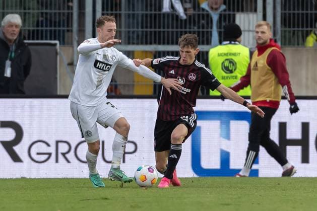 Germany, Spiesen Elversberg, 10 12 2023, Waldstadion Kaiserlinde, SV Elversberg vs FC Nürnberg 2 Bundesliga, Matchday 16, Maurice Neubauer SV 07 Elversberg and Benjamin Goller 1 FC Nuernberg battle for the ball Spiesen Elversberg URSAPHARM Arena an der Kaiserlinde Saarland Germany eu-images-542